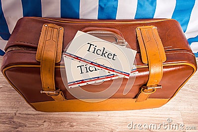 Vintage brown yellow leather bag suitcase with tickets. Travel m Stock Photo