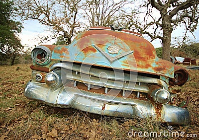 Vintage Cadillac sits in field awaiting restoration Editorial Stock Photo