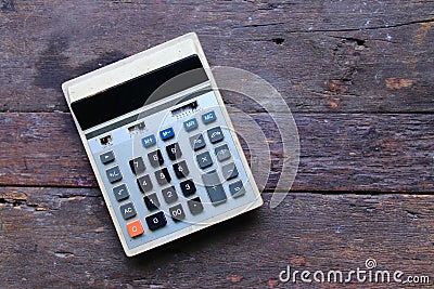 Vintage calculator on Old wood background Stock Photo