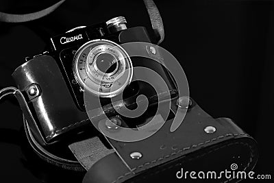 Vintage camera in the case on the mirror table Editorial Stock Photo