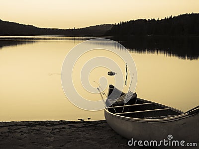 Vintage Canoe on Lake Stock Photo