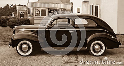 Vintage Car at Old Diner Sepia Toned Stock Photo