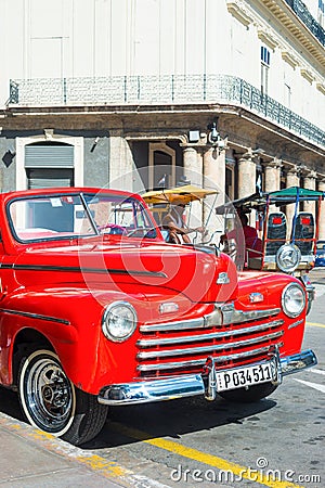 Vintage car parked on a famous street in Havana Editorial Stock Photo