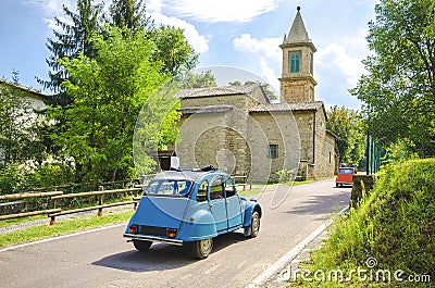 Vintage car travel italy countryside church Stock Photo