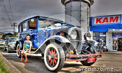 Vintage car and young boy Editorial Stock Photo