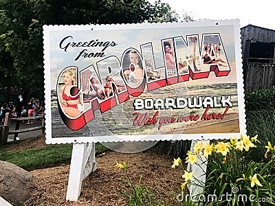 Greetings from Carolina Boardwalk Postcard Sign Editorial Stock Photo