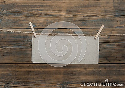 Vintage carton tag, paper for note with clothespin and a rope Stock Photo