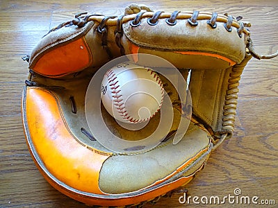 Vintage Catchers mitt with baseball. Stock Photo