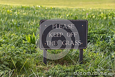 Vintage Caution Sign: Please Keep Off the Grass Stock Photo