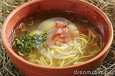 Vintage Ceramic Bowl of Homemade Noodle Soup Arishta Stock Photo
