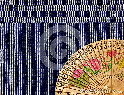 Vintage Chinese wood fan on cloth Stock Photo