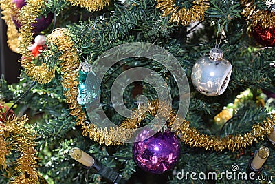 vintage Christmas decoration on an artificial tree, purple, siver and green Stock Photo