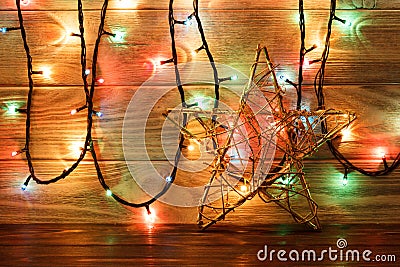 Vintage Christmas Decoration With Stars And Lights On Wooden Table Stock Photo