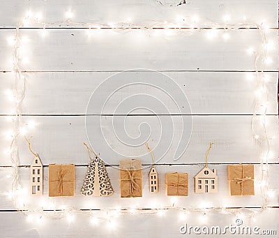 Vintage christmas decoration on wooden table - houses, tree, xm Stock Photo