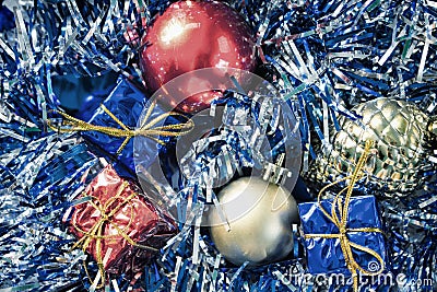 Vintage Christmas ornament photo. Christmas tree balls and wrapped gift boxes. Stock Photo