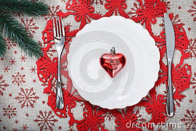 Vintage Christmas plate on holiday background with red heart Stock Photo