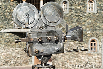 Vintage Cinema camcorder against the background of the castle walls Stock Photo