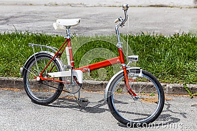 Vintage classic 70s red folding bicycle bike in perfect condition Stock Photo