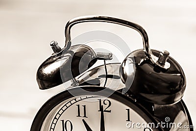 Vintage clock close up alarm ring bell. Stock Photo