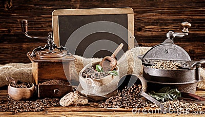 Vintage coffee roaster and grinder with beans Stock Photo