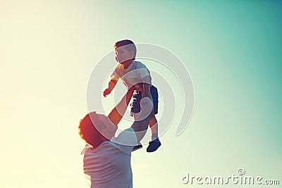 Vintage color photo happy joyful father throws up child Stock Photo