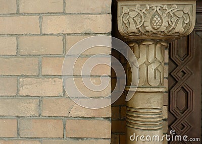 Vintage column made of embossed wood near brick wall in Madrid, Spain. Authentic Valencian style Stock Photo