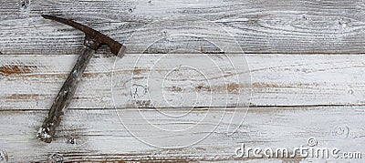 Vintage construction hammer on white rustic wooden boards Stock Photo
