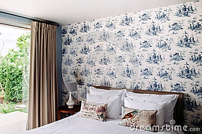Vintage cozy country home bedroom decoration with classic style wallpaper Editorial Stock Photo