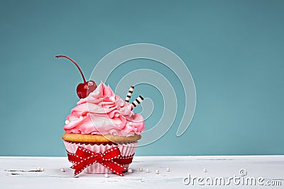 Vintage Cupcake with Cherry on Top Stock Photo