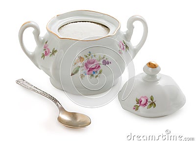 Vintage czech porcelain sugar-bowl, old style rich decorated by flower decors with teaspoon isolated on a white background Stock Photo