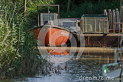 Vintage damaged orange boat with the name `Auf ein Neues Editorial Stock Photo