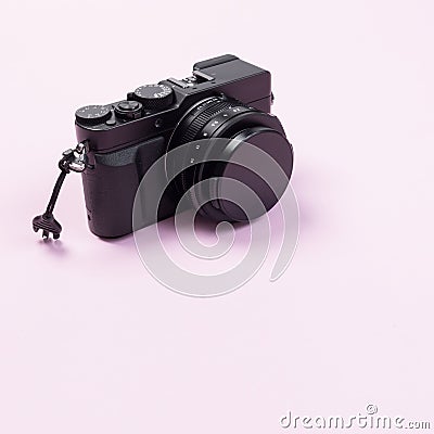 Vintage digital compact camera on pink pastel color Stock Photo