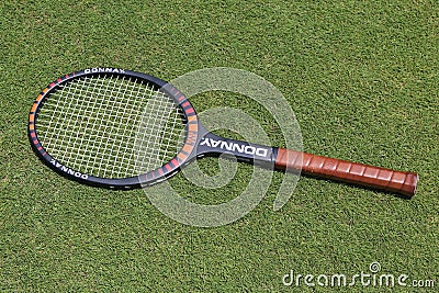 Vintage Donnay Borg Pro tennis racket on the grass tennis court. Editorial Stock Photo