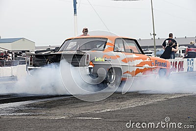 Vintage drag car in action at the starting line Editorial Stock Photo