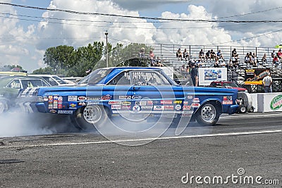 Vintage drag car smoke show on the track Editorial Stock Photo