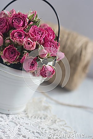 Vintage dried roses, napkin and tight twine Stock Photo