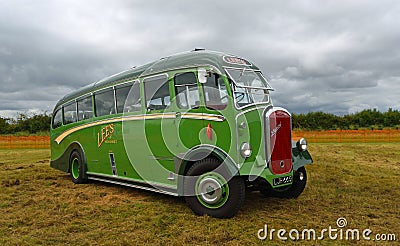 Vintage Duple bodied Dennis Lancet Coach parked isolated on grass. Editorial Stock Photo