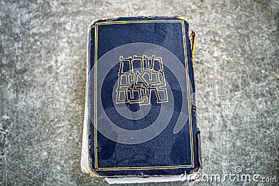 Vintage dusty Hebrew Bible book Tanakh Tanach on a on gray texture background, Israel Stock Photo