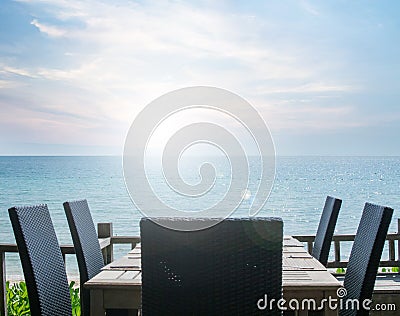 Vintage effected on table setting at beach restaurant, with sea view Stock Photo