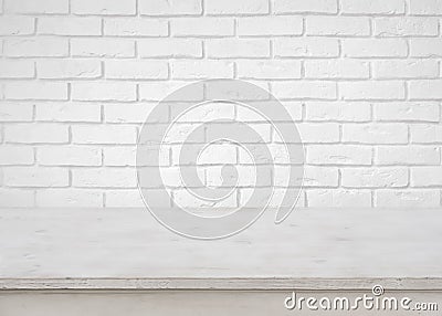 Vintage empty wooden table on defocused white brick wall background Stock Photo