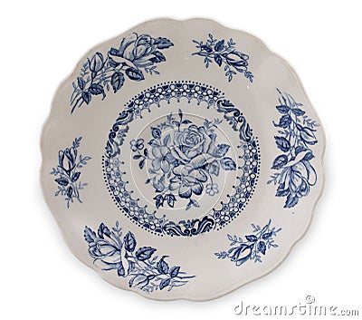 Vintage English porcelain. Very old saucer with blue floral decor, top view, close up Stock Photo