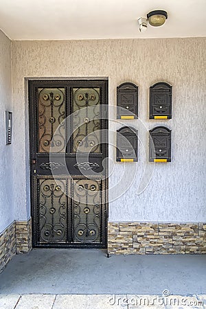 Vintage entrance in house with door and mailboxes Stock Photo