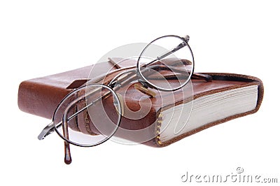 Vintage Eyeglasses and Leather Journal Stock Photo