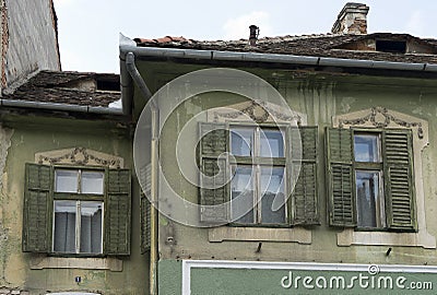 Vintage faÃ§ades with brown shutters in Sibiu Romania Stock Photo