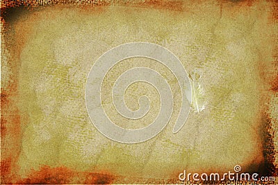 Vintage feather on grunge sand background Stock Photo