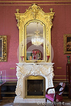 Vintage fireplace with mirror Stock Photo