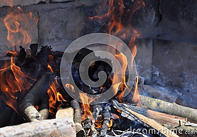 Vintage fireplace.Outdoor oven made of white brick with a wooden bucket. Rural summer kitchen. Stock Photo