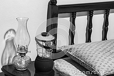 Vintage flat-wick kerosene oil lamp and modern battery operated lamp Stock Photo