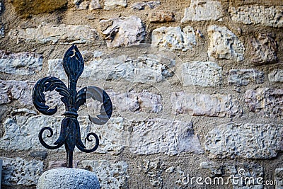 Vintage fleur-de-lys made of cast iron, Gubbio, the background, Umbria, Italy Stock Photo