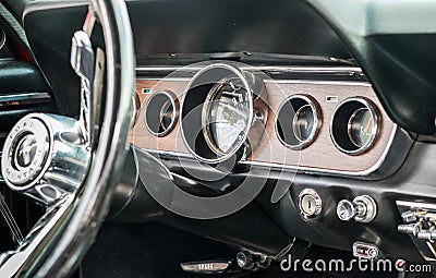 1966 vintage Ford Mustang interior - steering wheel with logo and dashboard Editorial Stock Photo